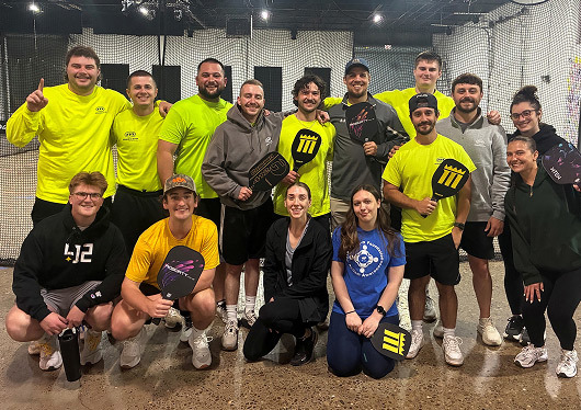 Group of Mascaro Construction workers playing pickleball