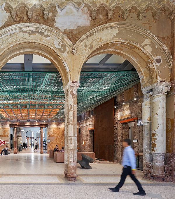 Mascaro Construction adaptive reuse project featuring restored historic architectural elements, preserved masonry details, and modern interior improvements within a renovated building.