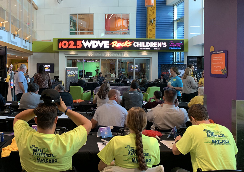 Mascaro volunteering at WDVE Rocks Children's Hospital Foundation fundraiser
