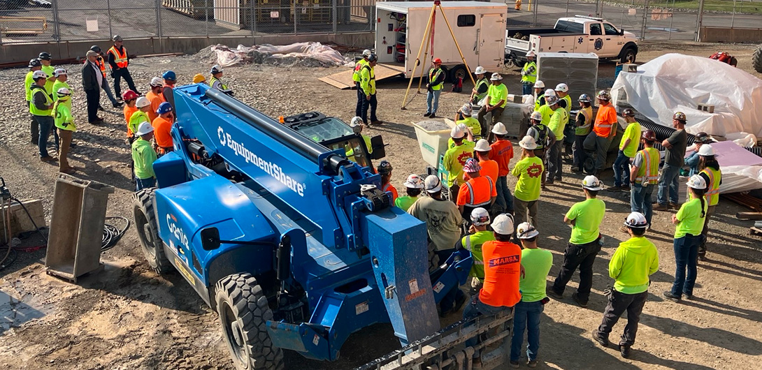 Job site with Mascaro Construction workers receiving a safety briefing