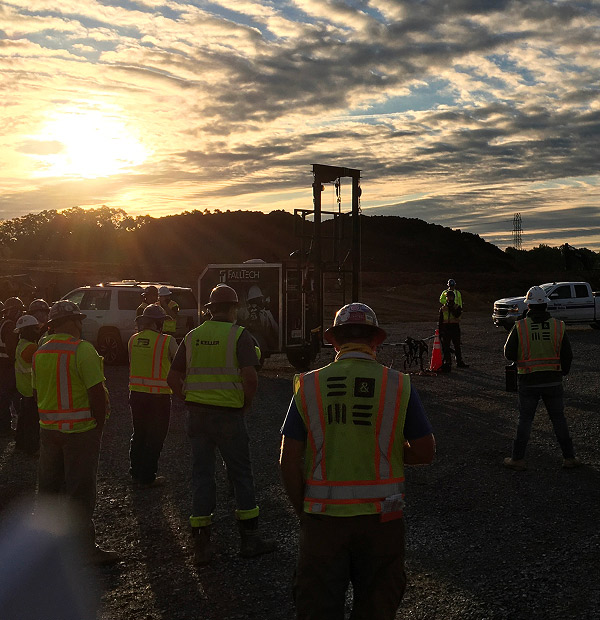 Mascaro Construction workers looking over a job site